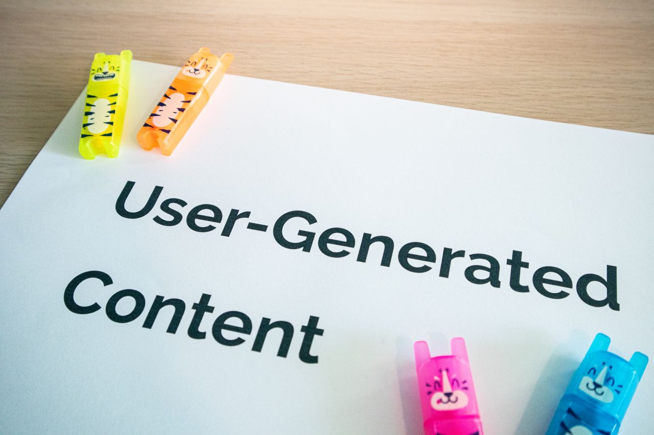 services-01 Vivid highlighters resting on a User-Generated Content note atop a wooden desk.